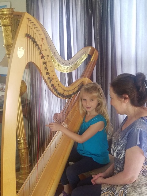 Child playing harp